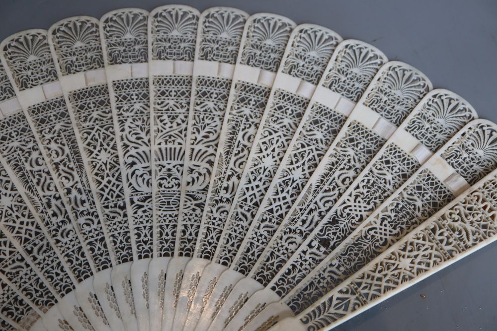 A 19th century French pierced ivory brise fan, length 28cm